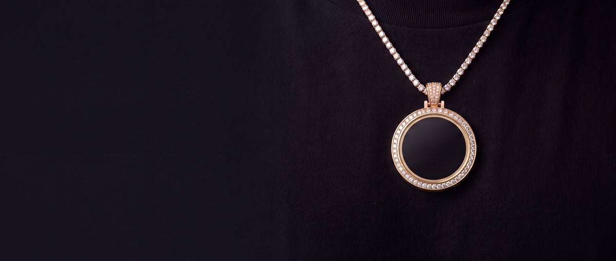 The medallion worn on a black t-shirt