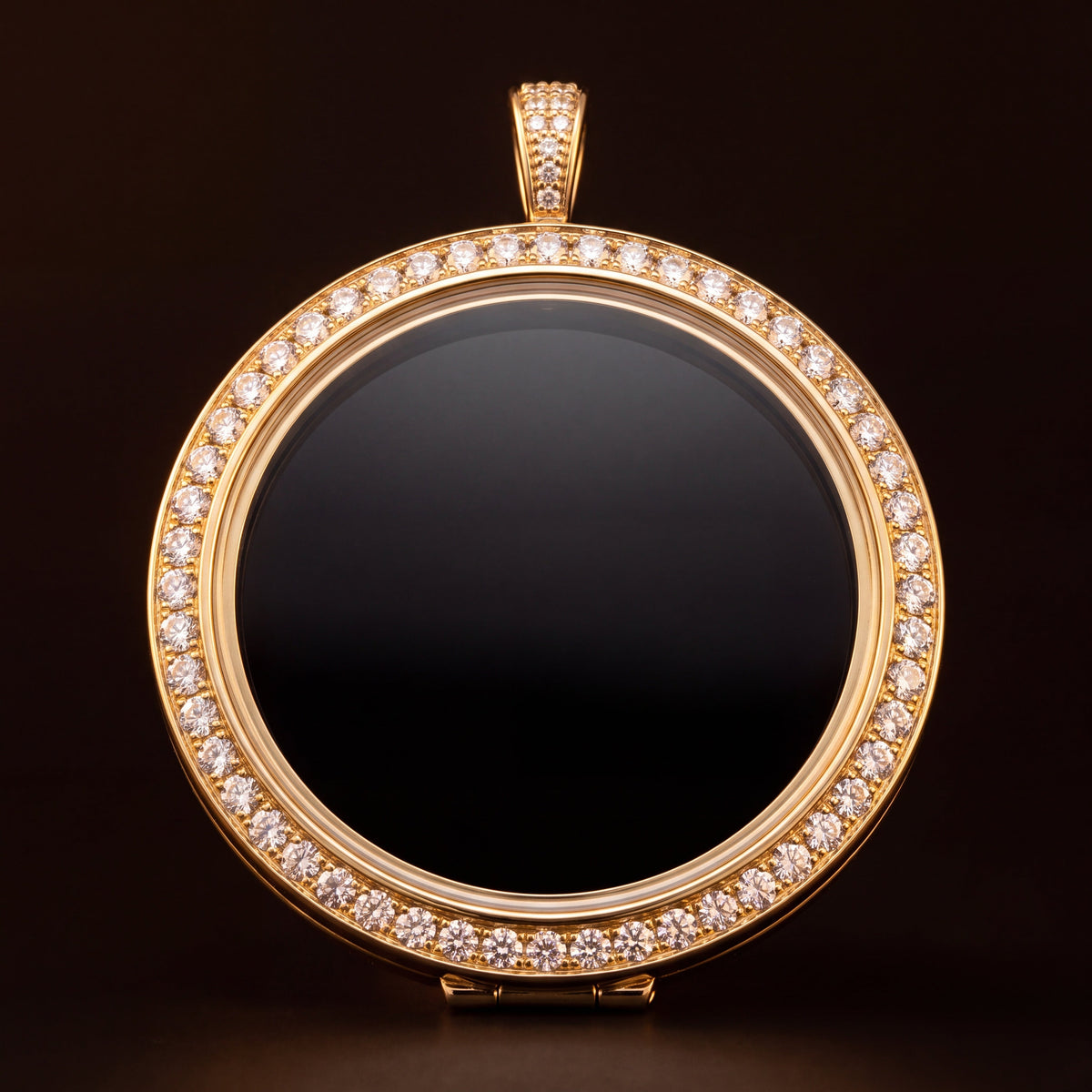 The Portrait Medallion in yellow gold, photographed square on against a dark ground