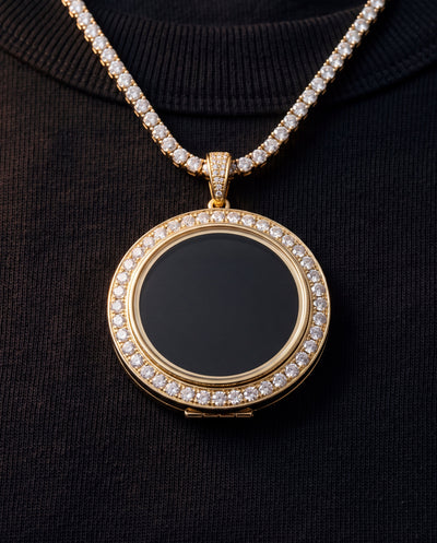 The medallion worn on a 4mm tennis chain over a black t-shirt