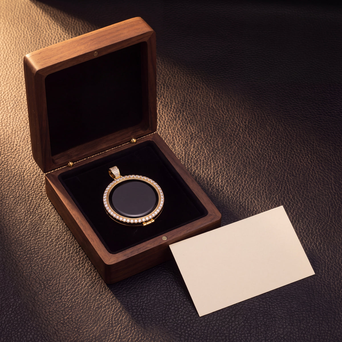 The medallion in an open presentation box beside a blank card