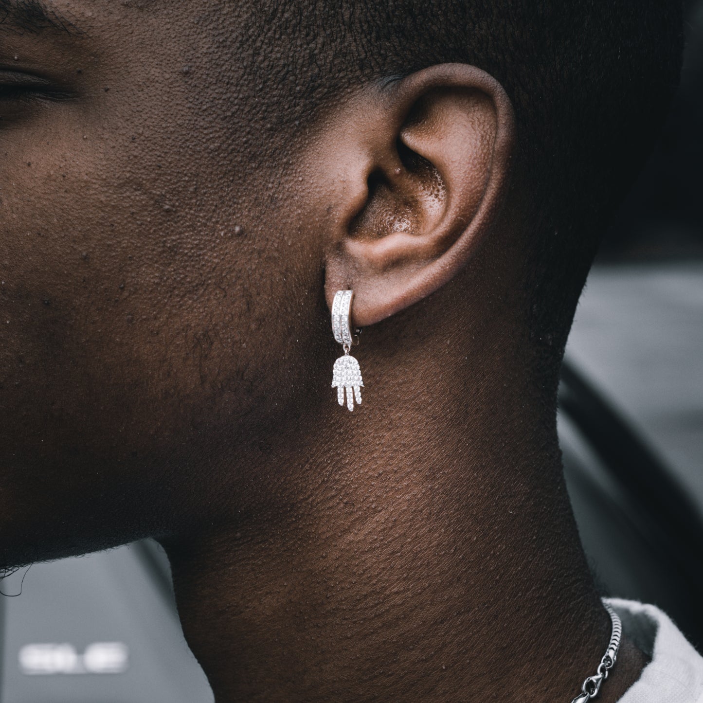 ICED HAMSA DANGLY HOOP EARRINGS IN WHITE GOLD